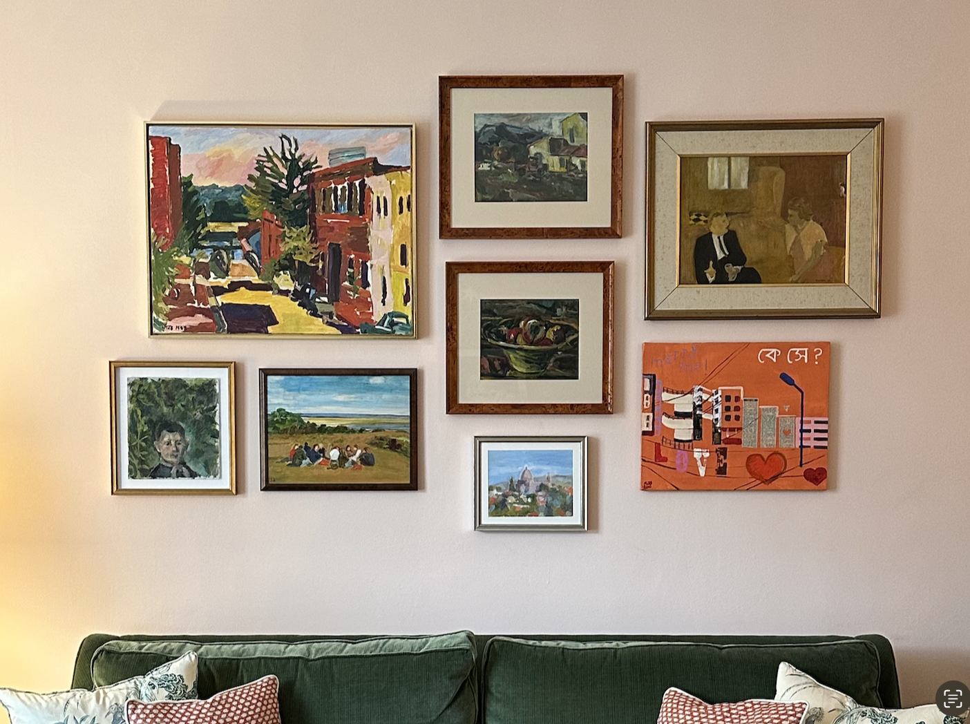A gallery wall of colorful paintings